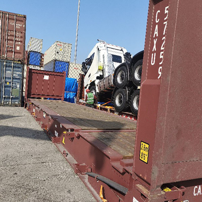 RORO/OOG φορτίο από Κινέζο πράκτορα εμπορευματικών μεταφορών για φορτηγό απορριμμάτων και μηχανή ανάμειξης σκυροδέματος και τρακτέρ